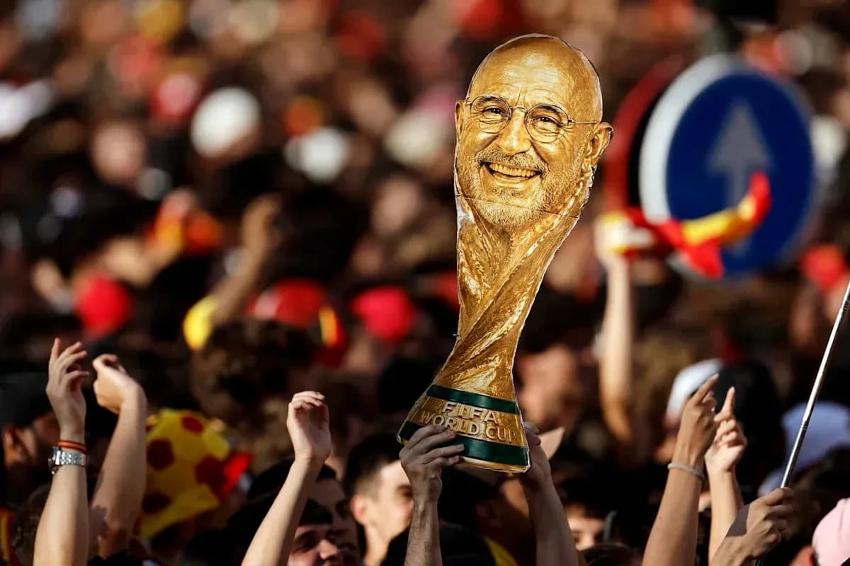 Supporters celebrating with a FIFA World Cup trophy