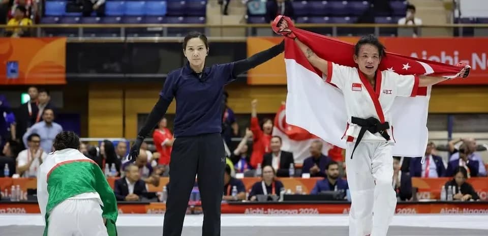 Athlete celebrating victory with flag after match