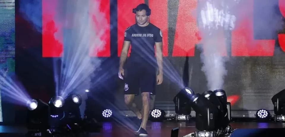 Athlete walking to the finals under stage lights