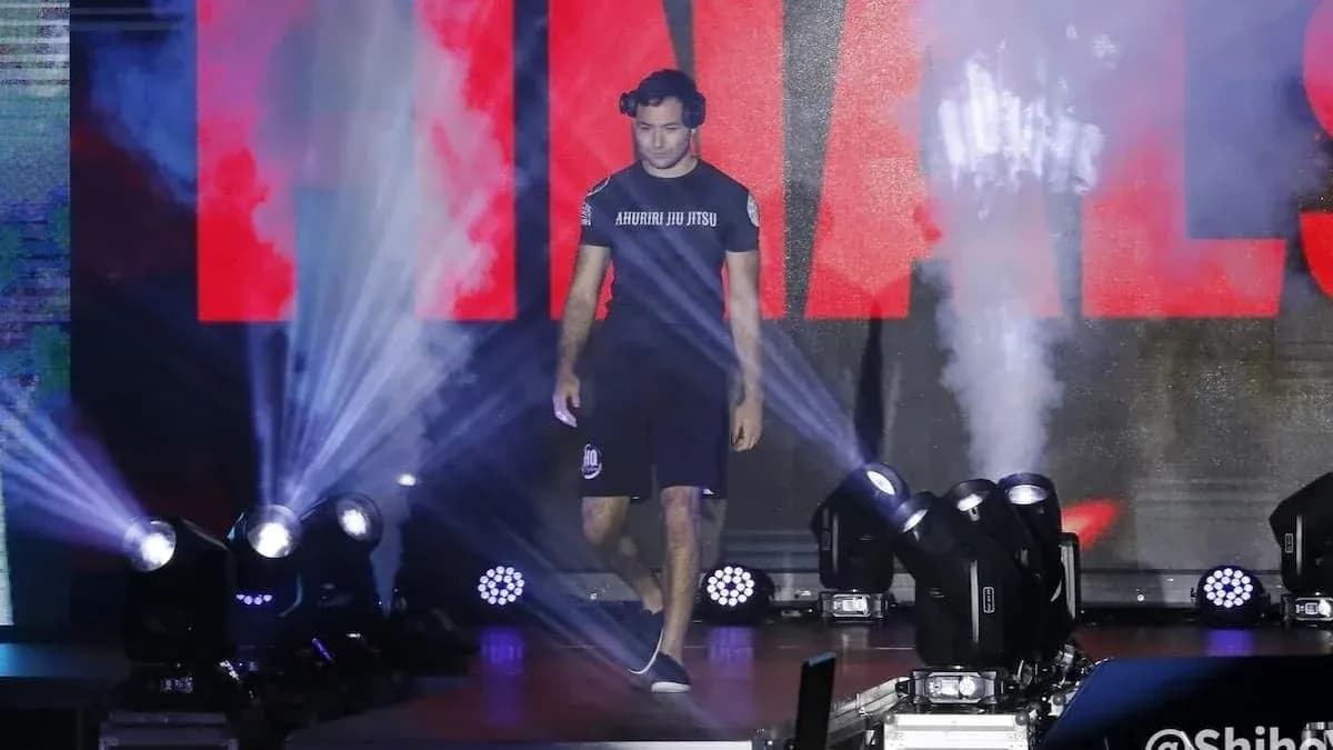 Athlete walking to the finals under stage lights