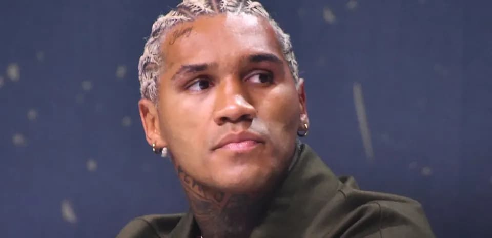 Athlete at a press conference with braided hair