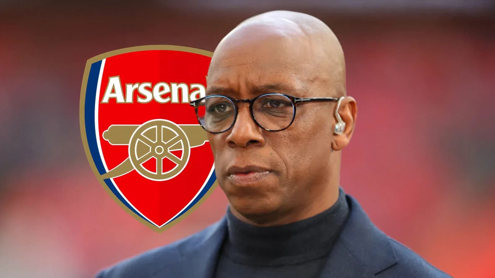 Person with glasses in front of Arsenal logo