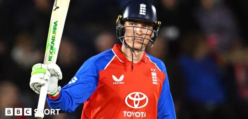 Joueur de cricket anglais levant sa batte en célébration