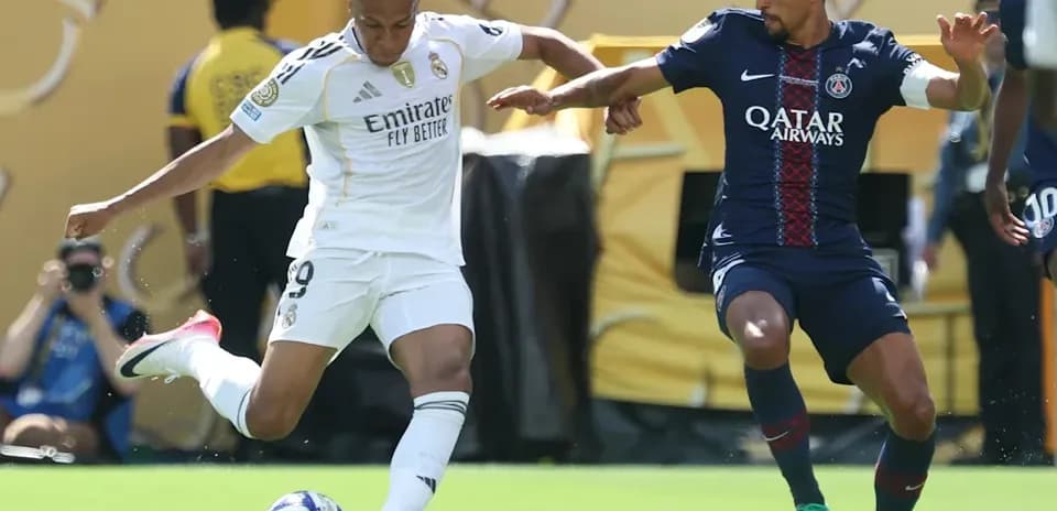 Mbappé dribbling past opponent during match