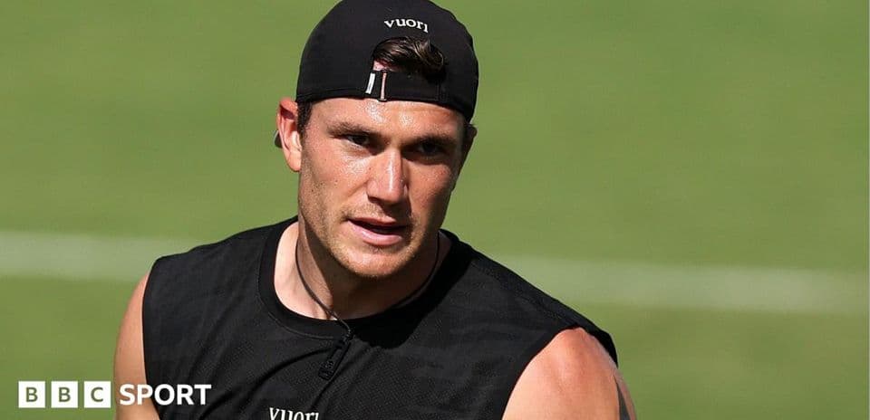 Athlete training on the field in black outfit