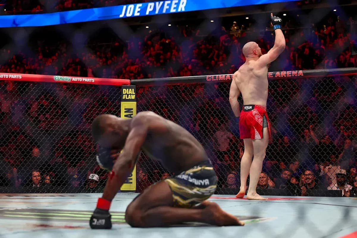 Joe Pyfer celebrating victory in the octagon