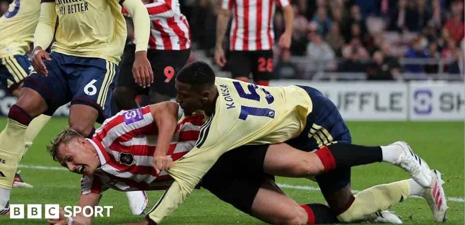 Joueur en train de plaquer un adversaire au sol