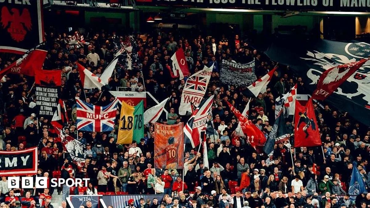 Supporters waving flags in stadium stands