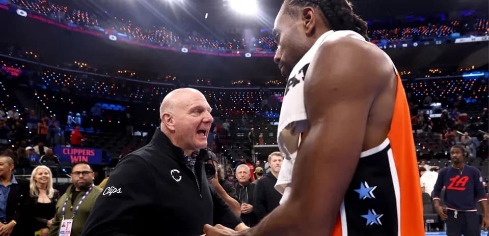 Kawhi Leonard and owner celebrating Clippers' victory