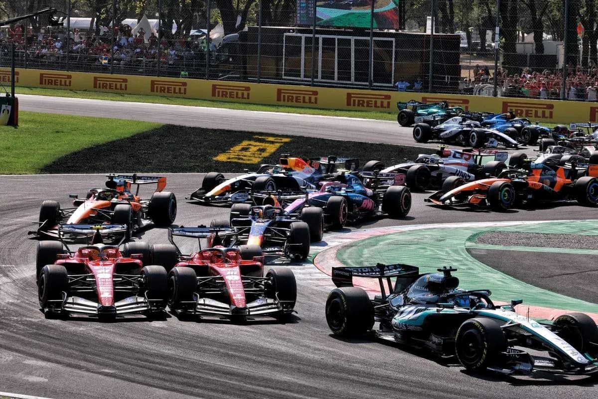 Multiple Formula 1 cars racing on track during event