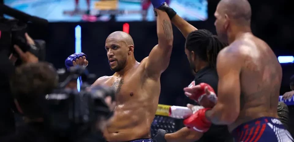 Fighter celebrating victory after match in octagon