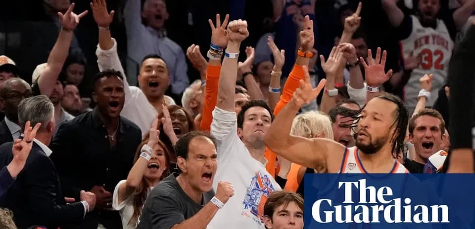 Spectators celebrating during a basketball game