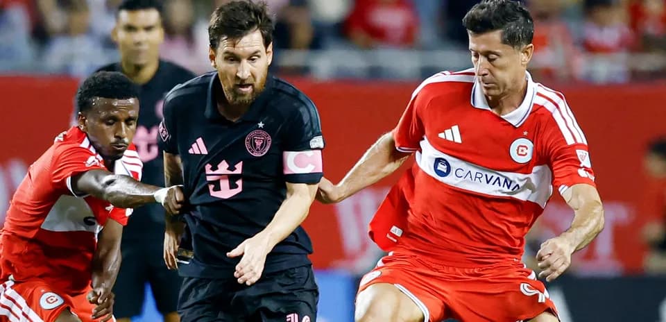 Messi dribbling past defenders during a match