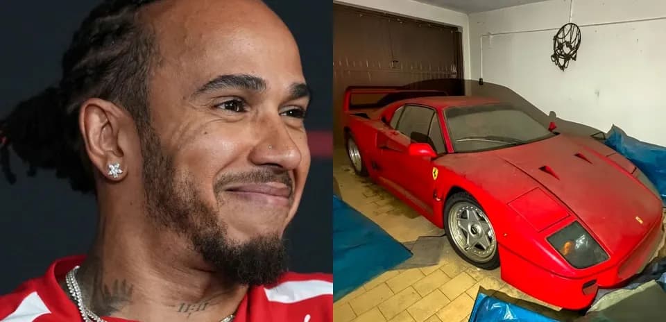 Lewis Hamilton smiling next to a covered Ferrari