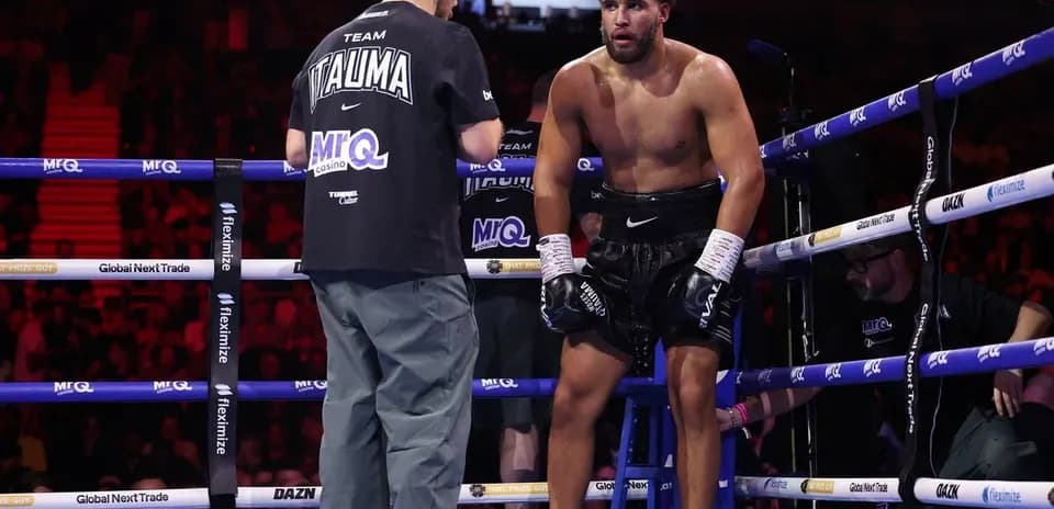 Boxer receiving instructions in the corner during match