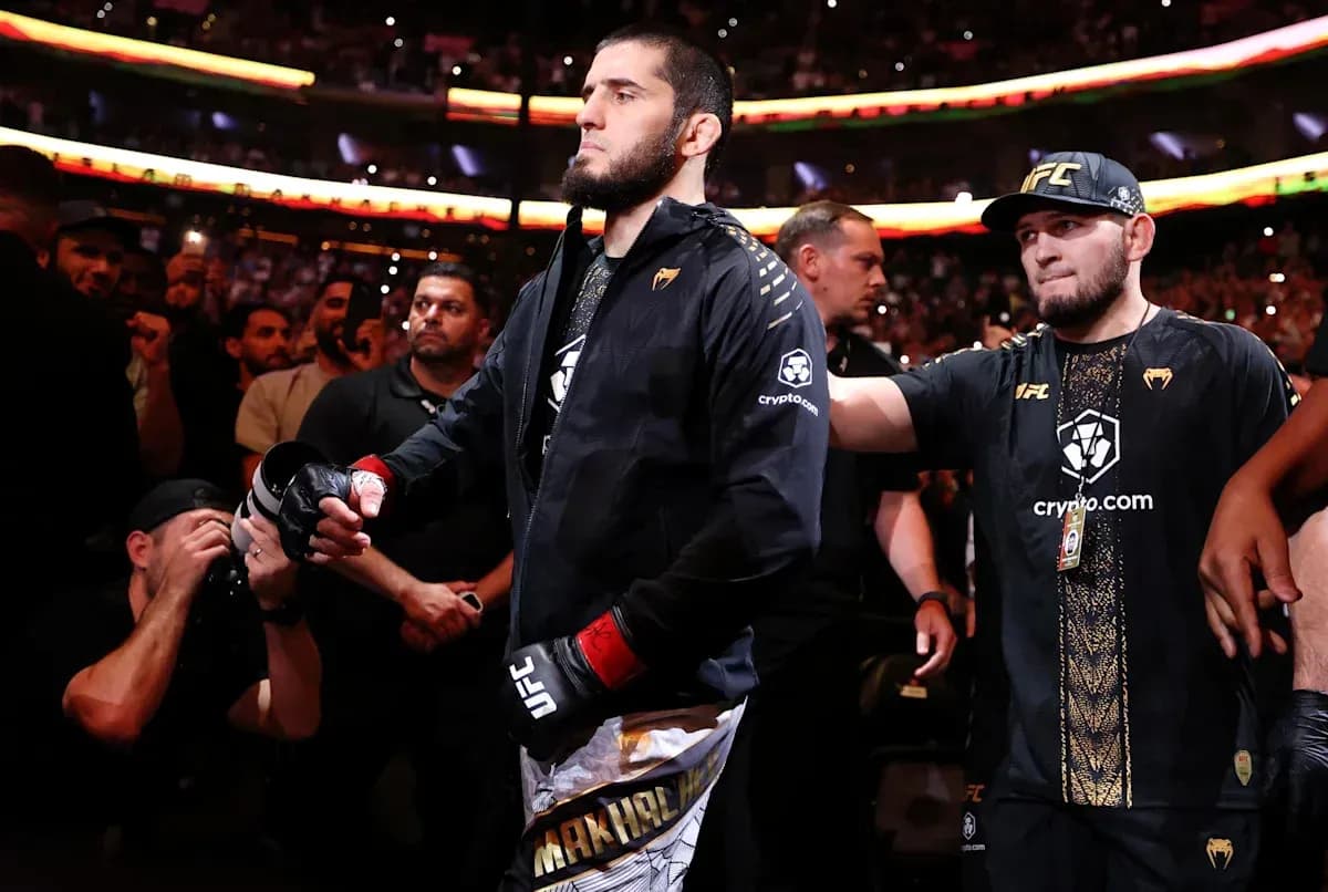 Fighter entering the arena surrounded by supporters