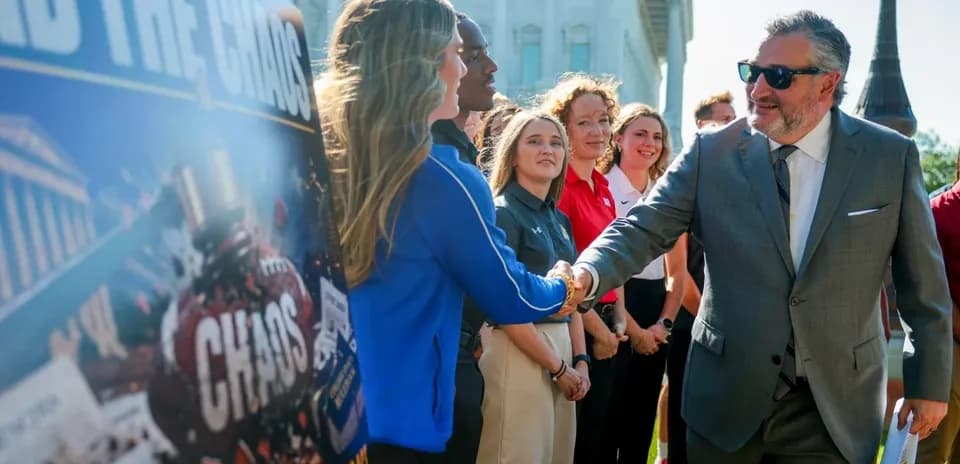 Person shaking hands at public event with attendees