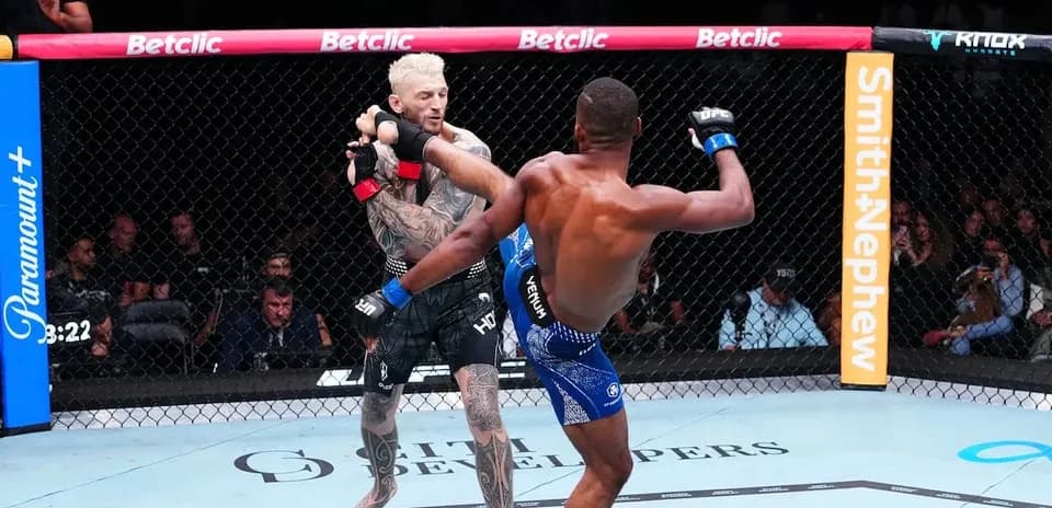 Combatants exchanging strikes in the octagon