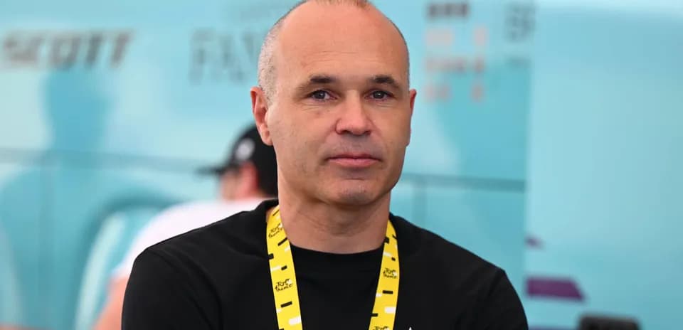 Person with lanyard at cycling event backdrop