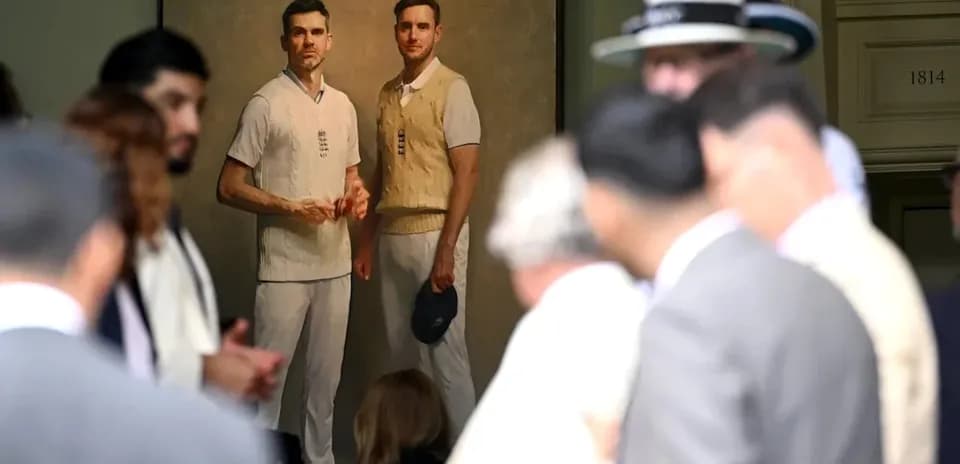 Portrait of two cricketers displayed at event