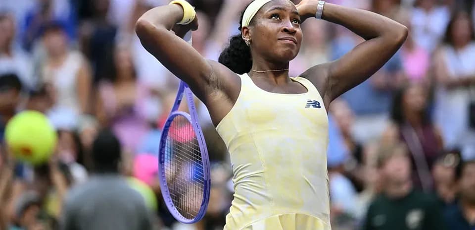 Coco Gauff celebrating with racket after match