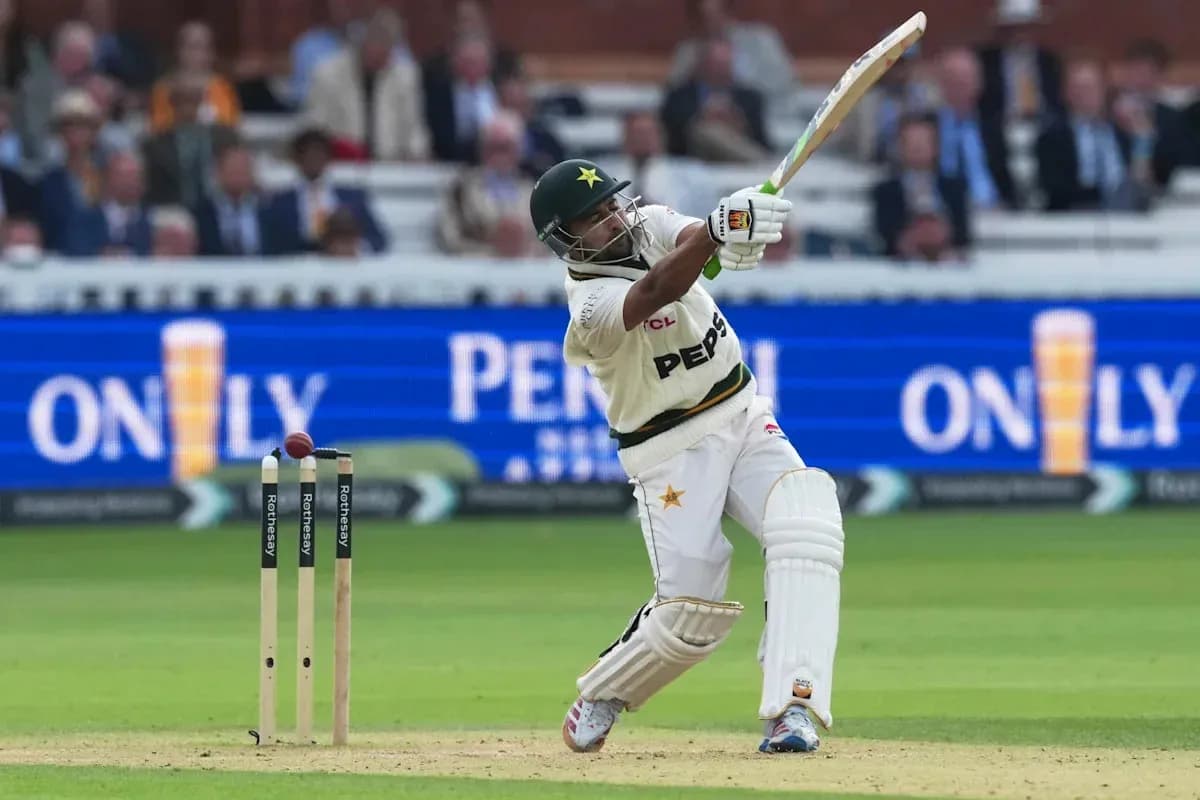 Batsman hitting ball during cricket match at Lord's