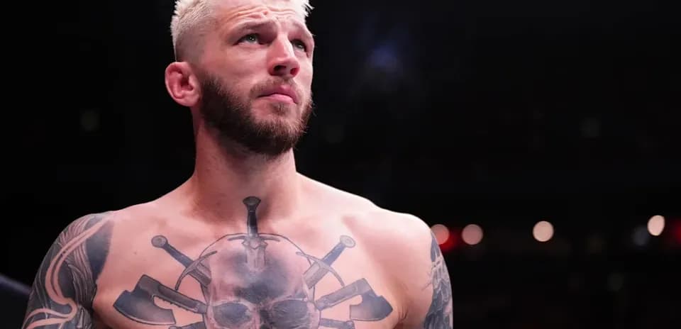 Fighter with tattoos preparing for match