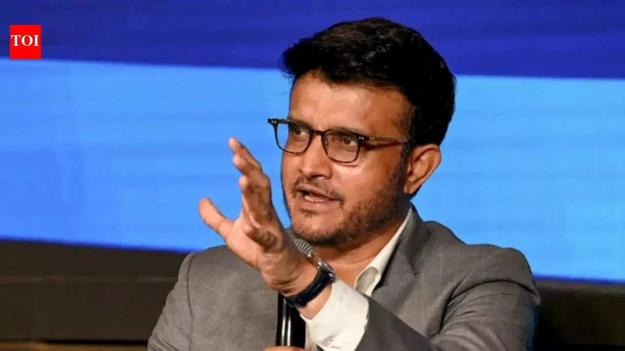 Person gesturing while speaking at an event