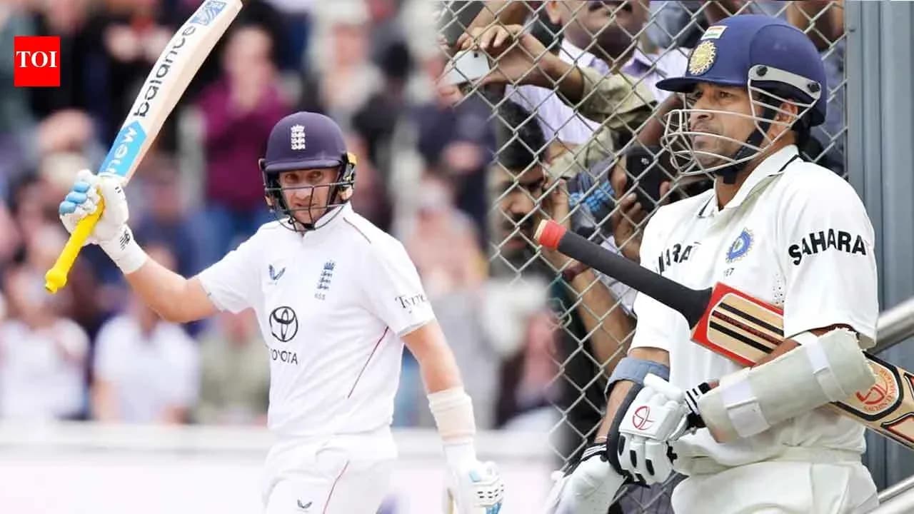 Batsman celebrating while another waits to bat Batsman celebrating while another waits to bat