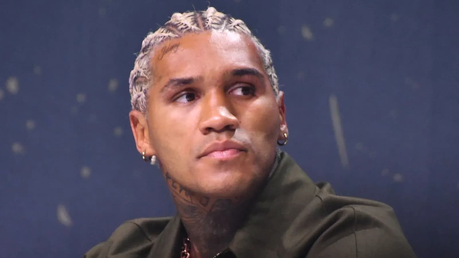 Athlete at a press conference with braided hair Athlete at a press conference with braided hair