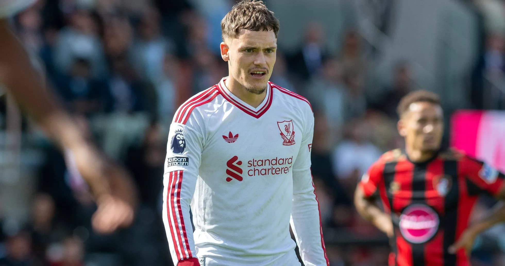 Joueur de Liverpool en action sur le terrain Joueur de Liverpool en action sur le terrain
