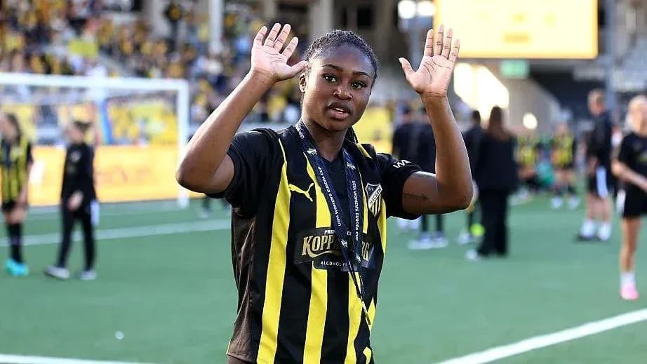 Joueuse saluant les supporters sur le terrain Joueuse saluant les supporters sur le terrain