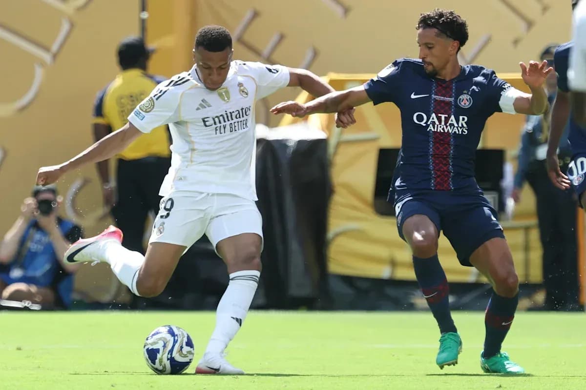 Mbappé dribbling past opponent during match Mbappé dribbling past opponent during match