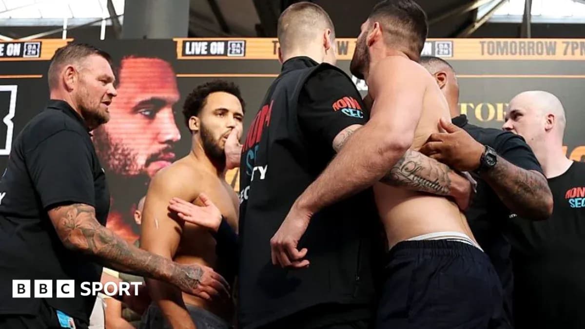 Boxers facing off during weigh-in event Boxers facing off during weigh-in event