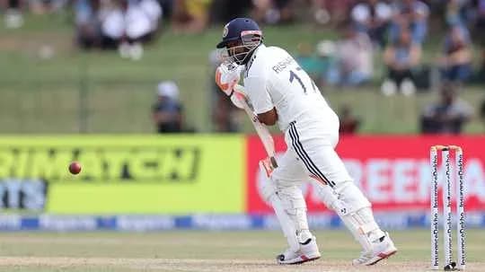Batsman playing a defensive shot in cricket match Batsman playing a defensive shot in cricket match