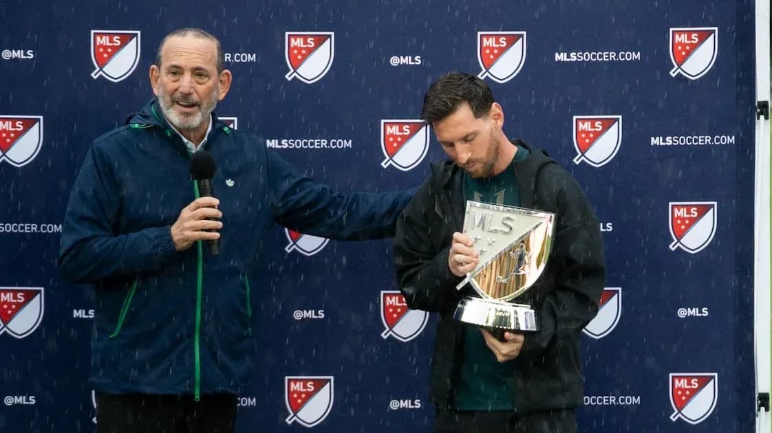Messi holding MLS trophy during award presentation Messi holding MLS trophy during award presentation