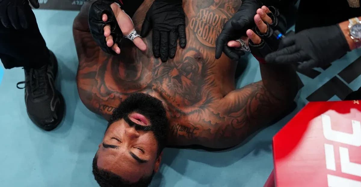Fighter receiving medical attention in the octagon Fighter receiving medical attention in the octagon