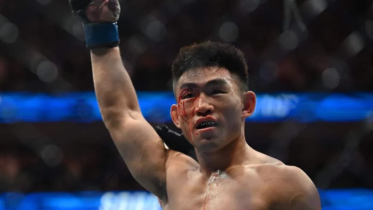 Fighter celebrating victory with bloodied face Fighter celebrating victory with bloodied face