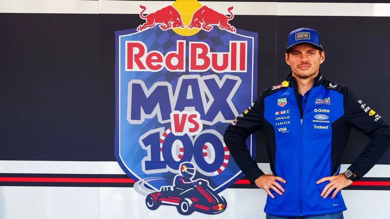 Pilote posant devant le panneau Red Bull MAX vs 100 Pilote posant devant le panneau Red Bull MAX vs 100
