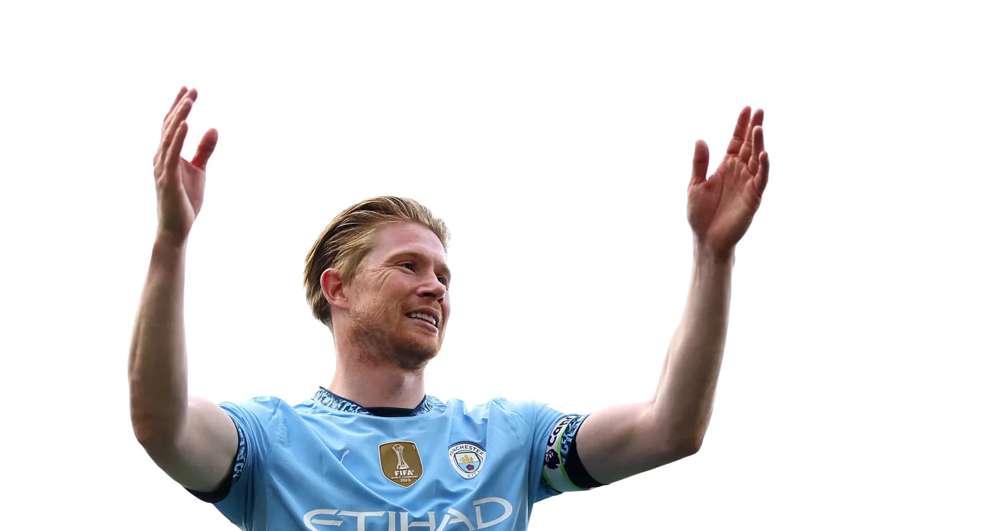 Joueur de Manchester City levant les bras en signe d'encouragement Joueur de Manchester City levant les bras en signe d'encouragement