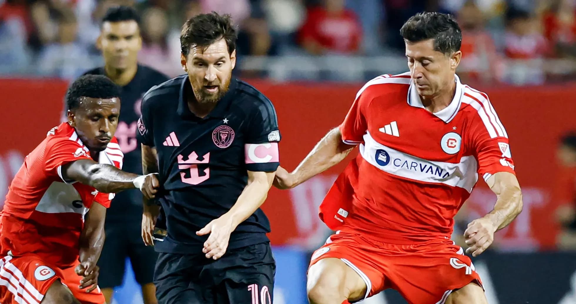 Messi dribbling past defenders during a match Messi dribbling past defenders during a match