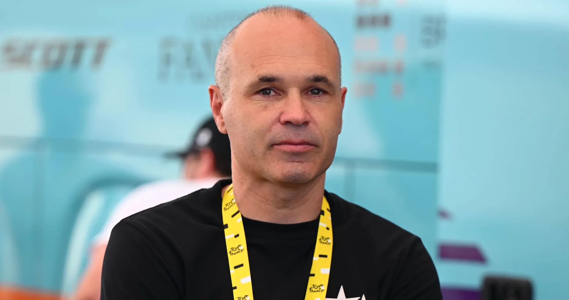 Person with lanyard at cycling event backdrop Person with lanyard at cycling event backdrop