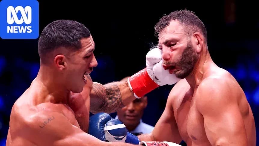 Boxer delivering a punch during a match Boxer delivering a punch during a match