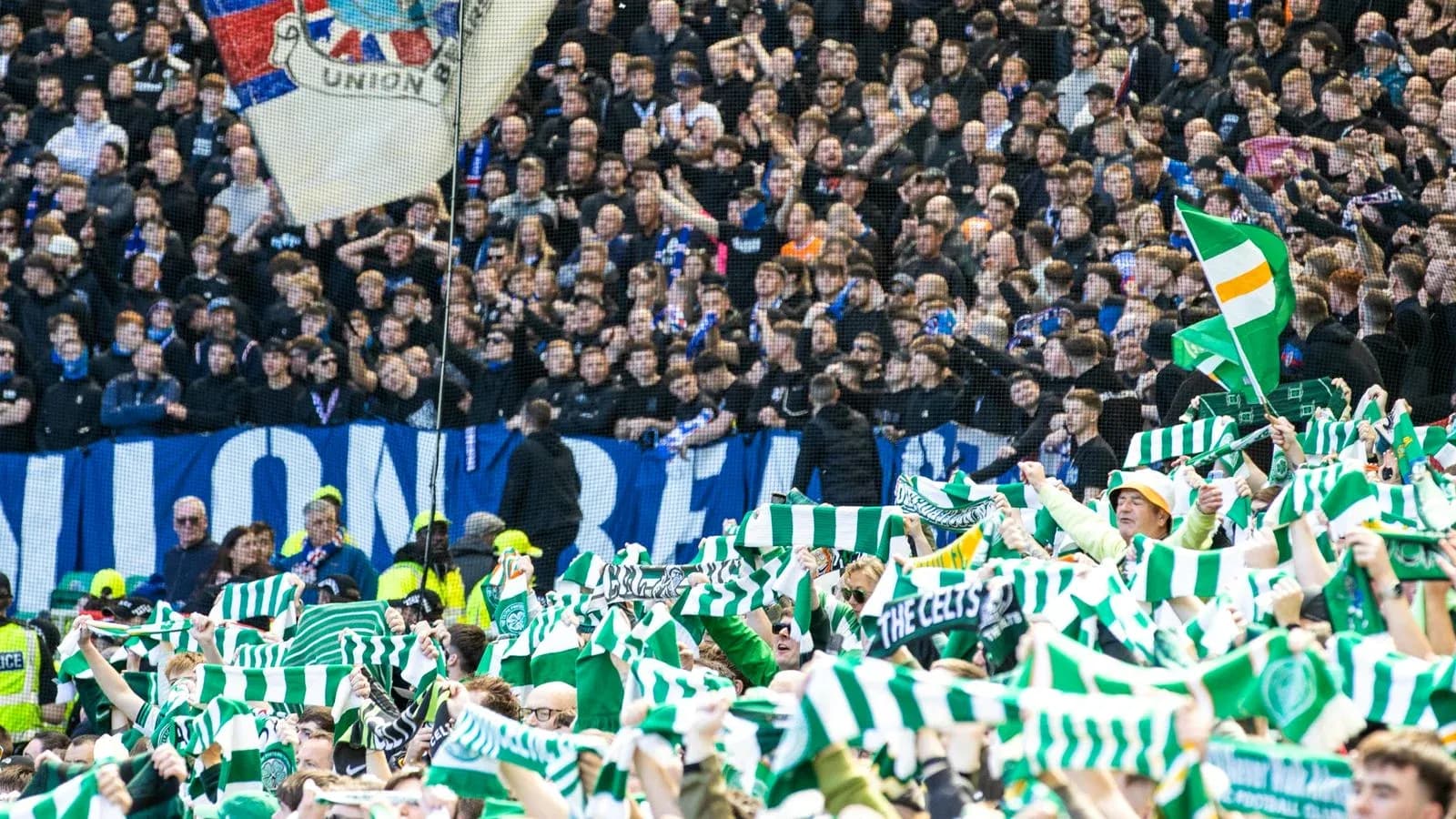 Supporters waving scarves during football match Supporters waving scarves during football match
