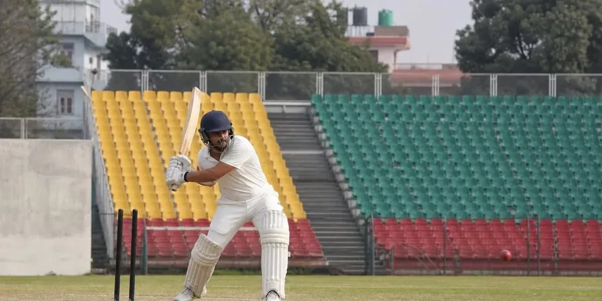 Joueur de cricket en action sur le terrain Joueur de cricket en action sur le terrain